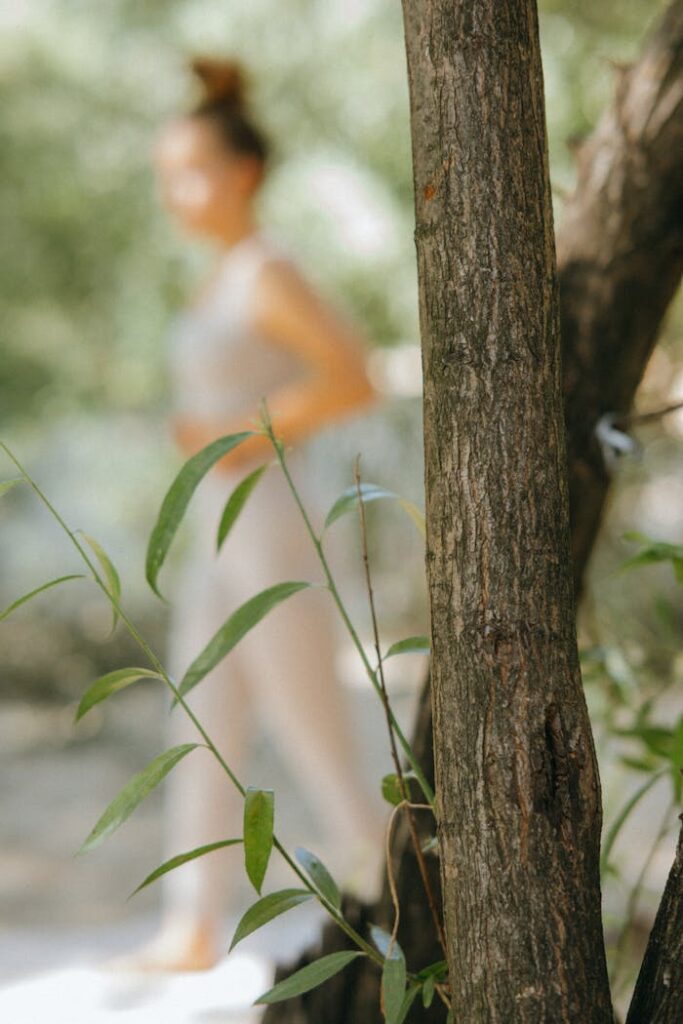 A woman practicing yoga outdoors, blending serenity and nature.